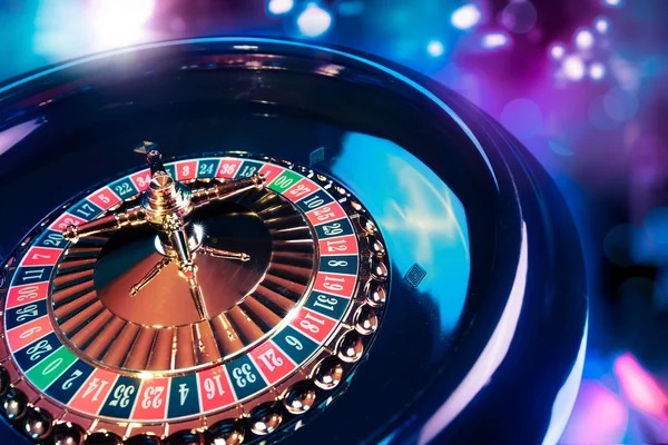 Roulette wheel spinning with betting layout visible